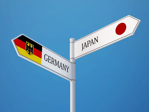 Japan Tyskland tecken flaggor koncept — Stockfoto