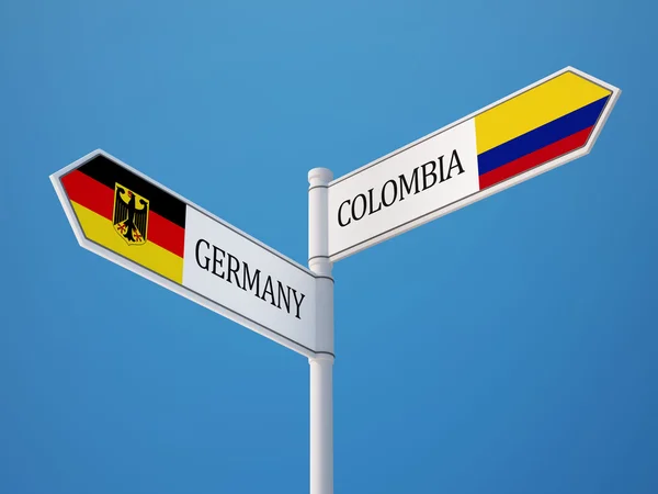 Colombia Tyskland tecken flaggor koncept — Stockfoto