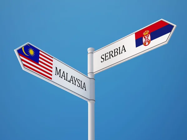 Serbien Malaysia tecken flaggor koncept — Stockfoto