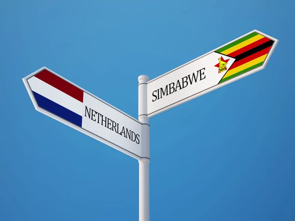 Zimbabué Holanda assinar Bandeiras Conceito — Fotografia de Stock