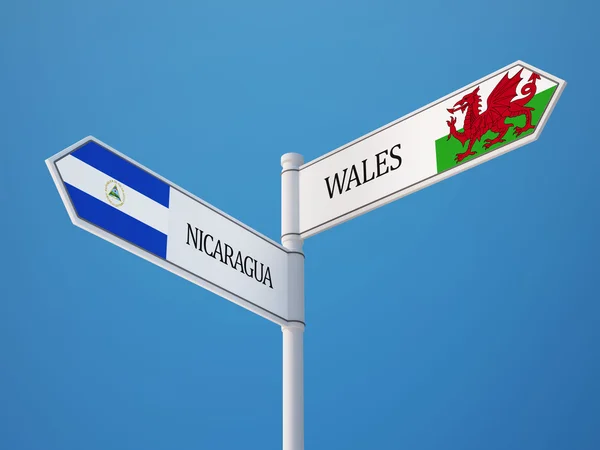 Wales Nicaragua teken vlaggen Concept — Stockfoto
