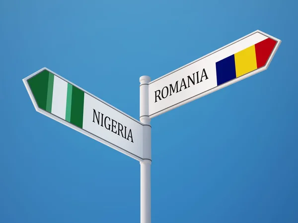 Rumänien Nigeria tecken flaggor koncept — Stockfoto