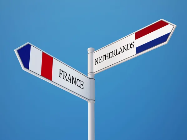 Frankrike Nederländerna underteckna flaggor koncept — Stockfoto