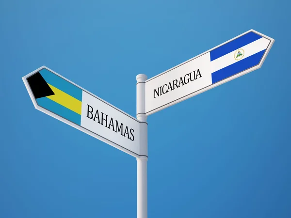 Nicaragua Bahamas tecken flaggor koncept — Stockfoto