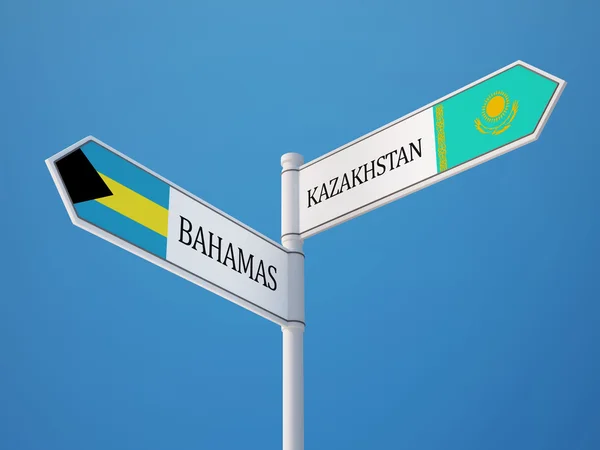 Kazakstan Bahamas tecken flaggor koncept — Stockfoto