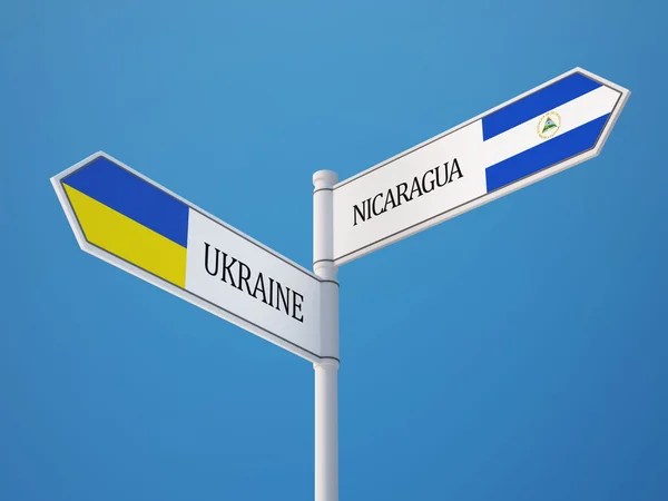 Ukraina Nikaragui znak flagi koncepcja — Zdjęcie stockowe