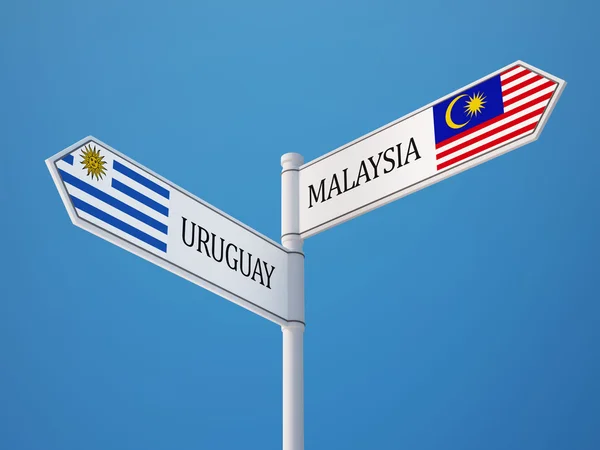 Uruguay Malaysia tecken flaggor koncept — Stockfoto