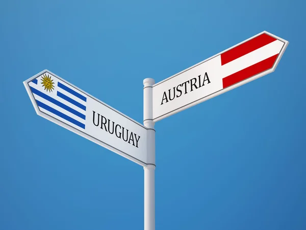 Uruguay Österrike underteckna flaggor koncept — Stockfoto
