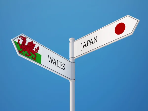 Wales Japan undertecknar flaggor koncept — Stockfoto