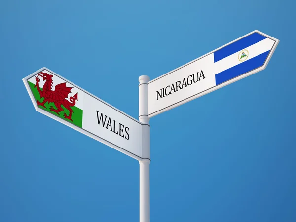 Wales Nicaragua tecken flaggor koncept — Stockfoto