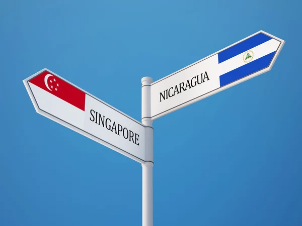 Singapore Nicaragua tecken flaggor koncept — Stockfoto