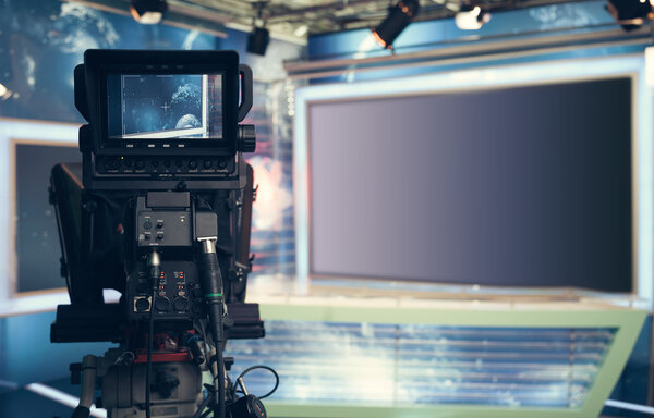 Television studio with camera and lights - recording TV NEWS