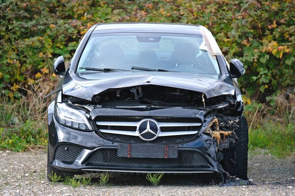 Neu-Ulm, Germany - October, 12, 2025: Front view of a accident-damaged Mercedes C Class car.
