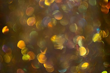 Golden unfocused bokeh light background.