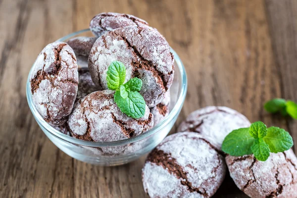 Bowl of chocolate cookies on the wooden background — Stock Photo, Image