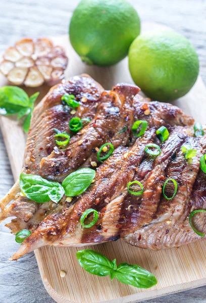 Grilled turkey with green scallion on the wooden board — Stock Photo, Image