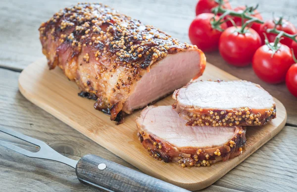 Baked pork meat wrapped in bacon — Stock Photo, Image
