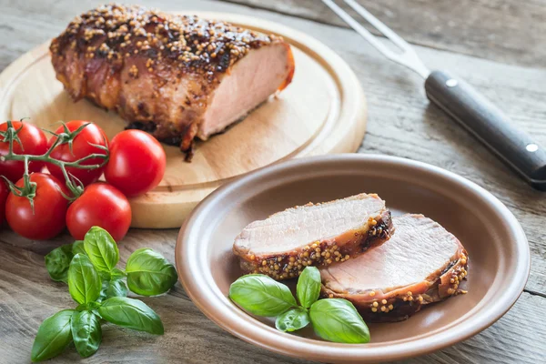 Baked pork meat wrapped in bacon — Stock Photo, Image