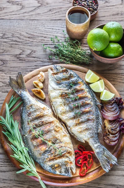 Grilled Dorade Royale Fish on the wooden board — Stock Photo, Image