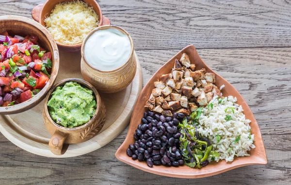 Chicken burrito bowl with the ingredients — Stock Photo, Image