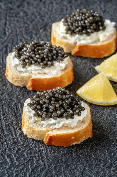 Baguette Slices Cream Cheese Black Caviar — Stock Photo, Image