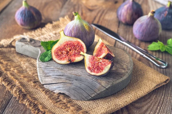 Fresh figs on the rustic wooden board