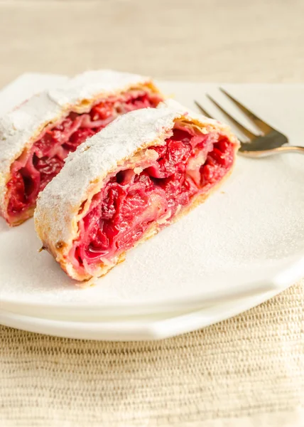 Cherry strudel on the square plate — Stock Photo, Image