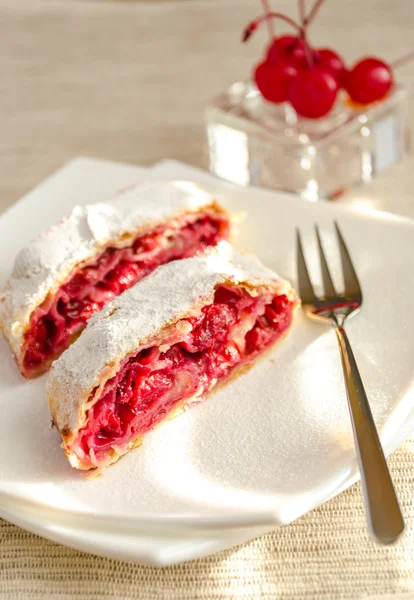 Cherry strudel on the square plate — Stock Photo, Image