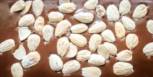 Luxury chocolate bar with whole almonds — Stock Photo, Image
