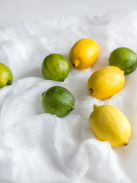 Lemons and limes on the white background — Stock Photo, Image