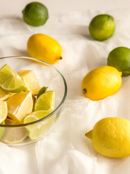 Lemons and limes on the white background — Stock Photo, Image