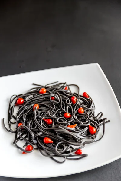 Pasta with wheat germ and black cuttlefish ink — Stock Photo, Image