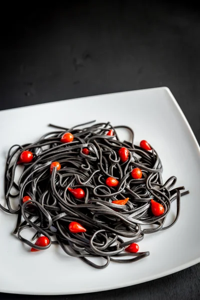 Pasta with wheat germ and black cuttlefish ink — Stock Photo, Image