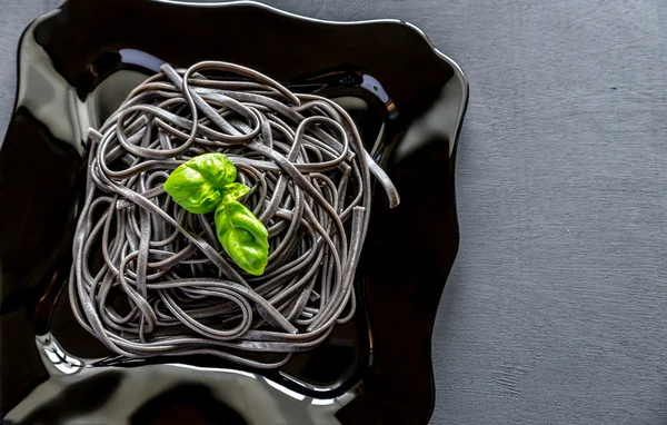 Pasta with wheat germ and black cuttlefish ink — Stock Photo, Image