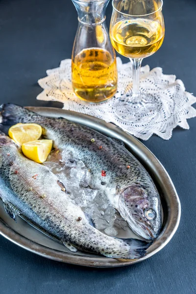 Fresh trouts in ice on the vintage metal tray — Stock Photo, Image