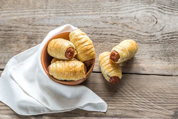 Bowl with sausage rolls — Stock Photo, Image