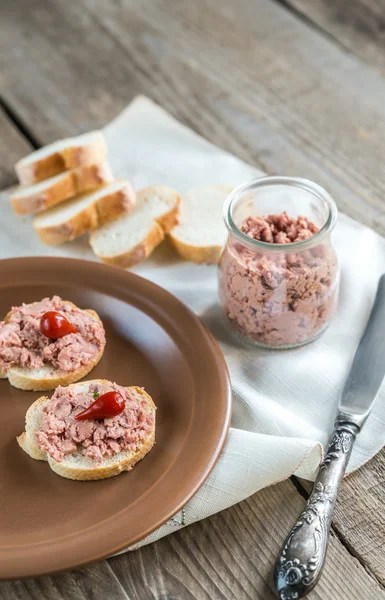 Sandwiches with pate on the wooden board — Stock Photo, Image