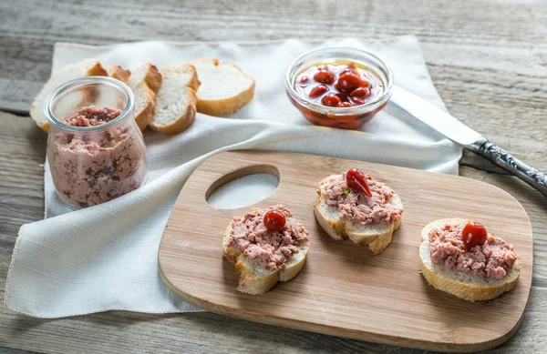 Sandwiches with pate on the wooden board — Stock Photo, Image