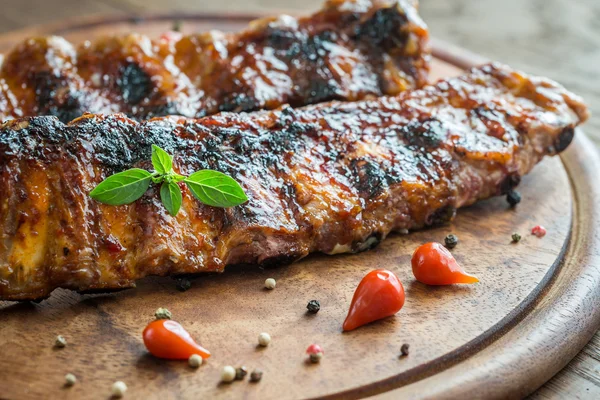 Grilled pork ribs  on the wooden board — Stock Photo, Image