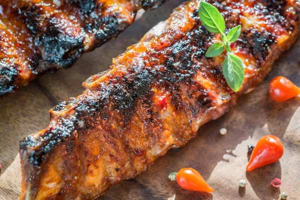 Grilled pork ribs on the wooden board — Stock Photo, Image