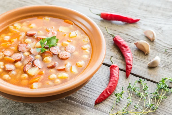 Soup with chickpeas and smoked sausage — Stock Photo, Image