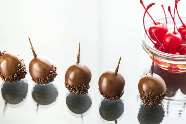 Chocolate and cocktail cherries on the glass — Stock Photo, Image