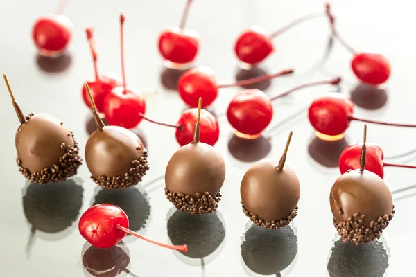Chocolate and cocktail cherries on the glass — Stock Photo, Image