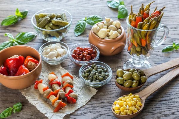 Pickled vegetables on the wooden background — Stock Image Pickled vegetables on the wooden background Stock Image