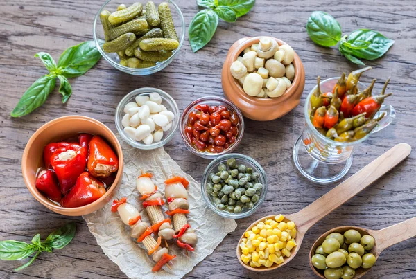 Pickled vegetables on the wooden background — Stock Image Pickled vegetables on the wooden background Stock Image