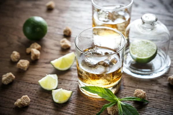 Glass of rum on the wooden background — Stock Photo, Image