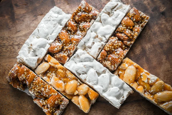 Turron slices on the wooden board — Stock Photo, Image