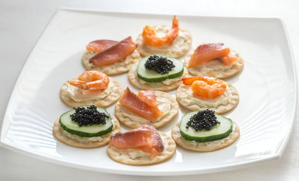 Canape with seafood on the plate — Stock Photo, Image