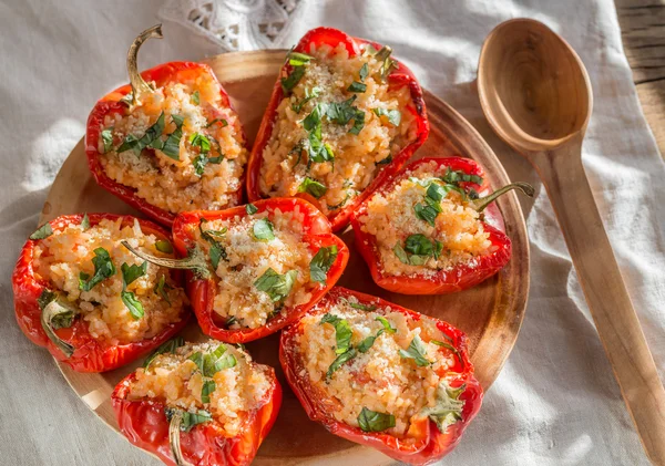 Stuffed red bell peppers with white rice and cheese — Stock Photo, Image