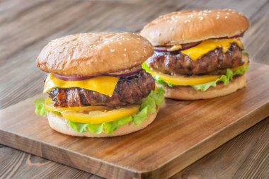 Melted cheese and crisp bacon meet golden buns in a hearty rustic presentation